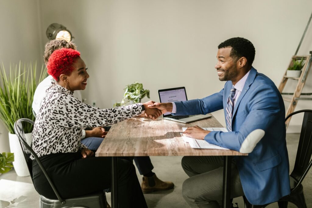 Couple sitting down with Mortgage Broker